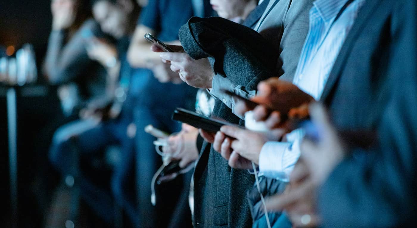 Visitors walk near Himeji Castle as tourists explore the historic site under bright daytime conditions