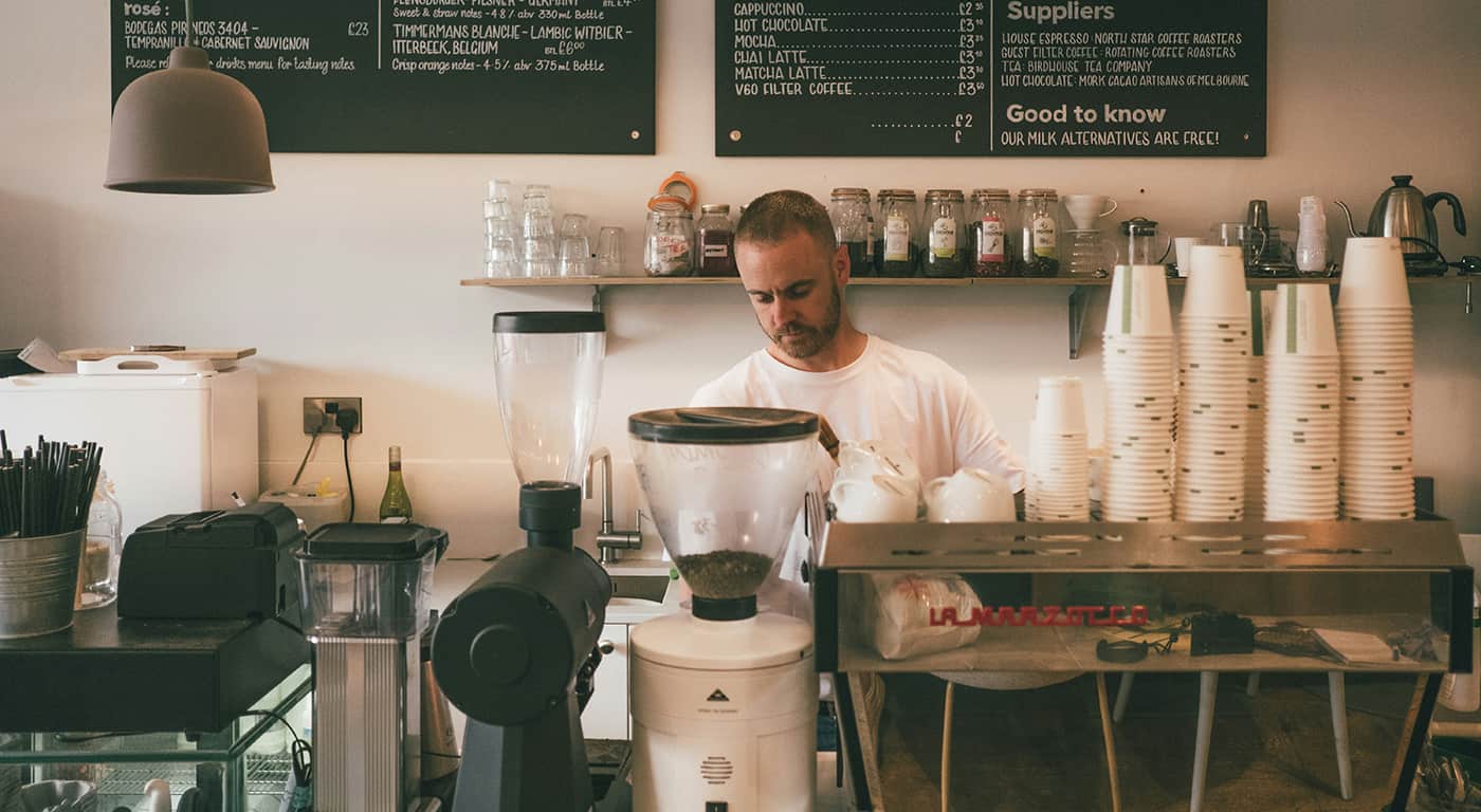 Visitors walk near Himeji Castle as tourists explore the historic site under bright daytime conditions