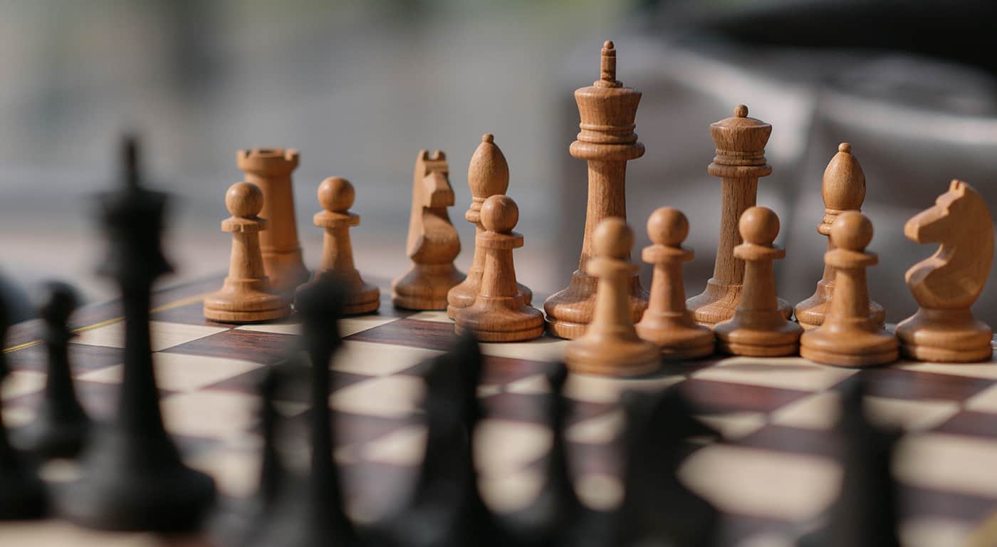 Visitors walk near Himeji Castle as tourists explore the historic site under bright daytime conditions