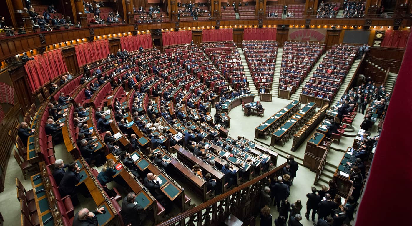 Visitors walk near Himeji Castle as tourists explore the historic site under bright daytime conditions