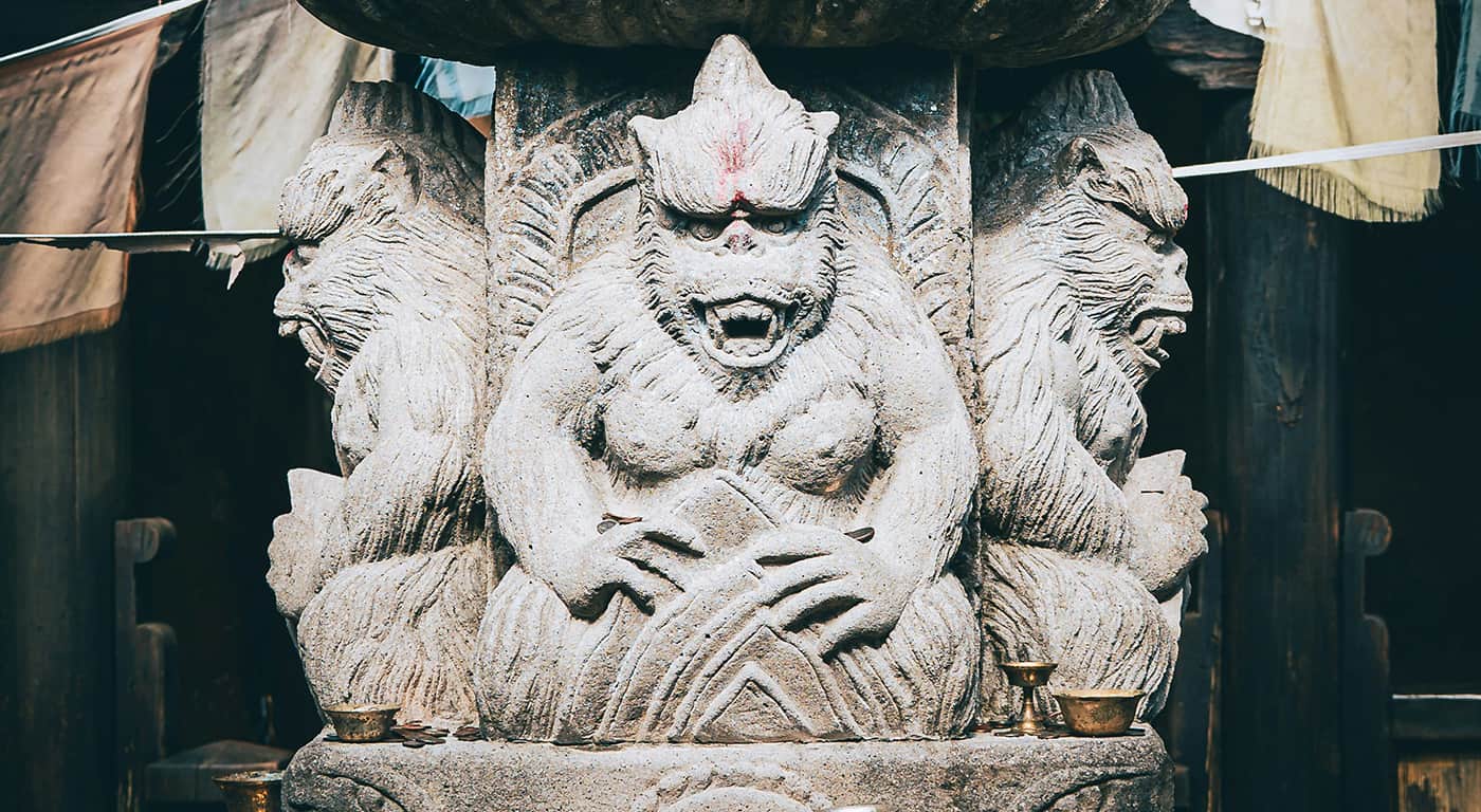 Visitors walk near Himeji Castle as tourists explore the historic site under bright daytime conditions
