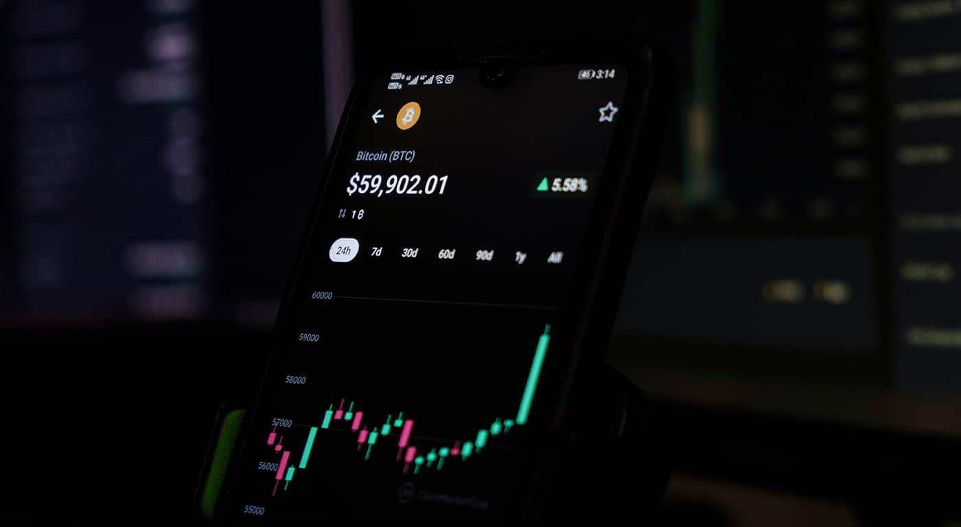 Visitors walk near Himeji Castle as tourists explore the historic site under bright daytime conditions