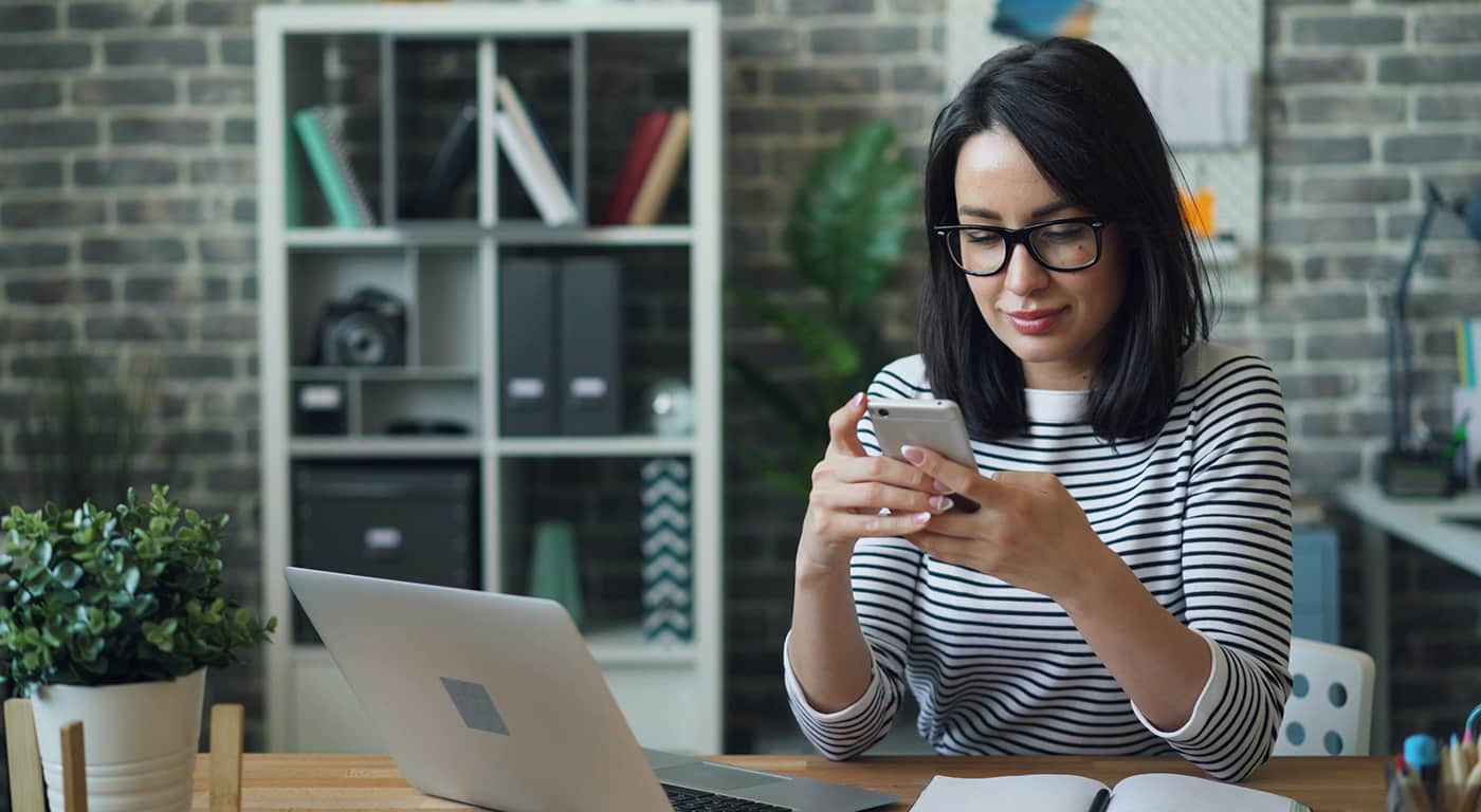 Visitors walk near Himeji Castle as tourists explore the historic site under bright daytime conditions