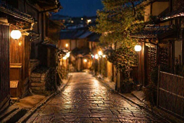 Quiet lantern-lit Kyoto street at night with wooden buildings and stone pavement